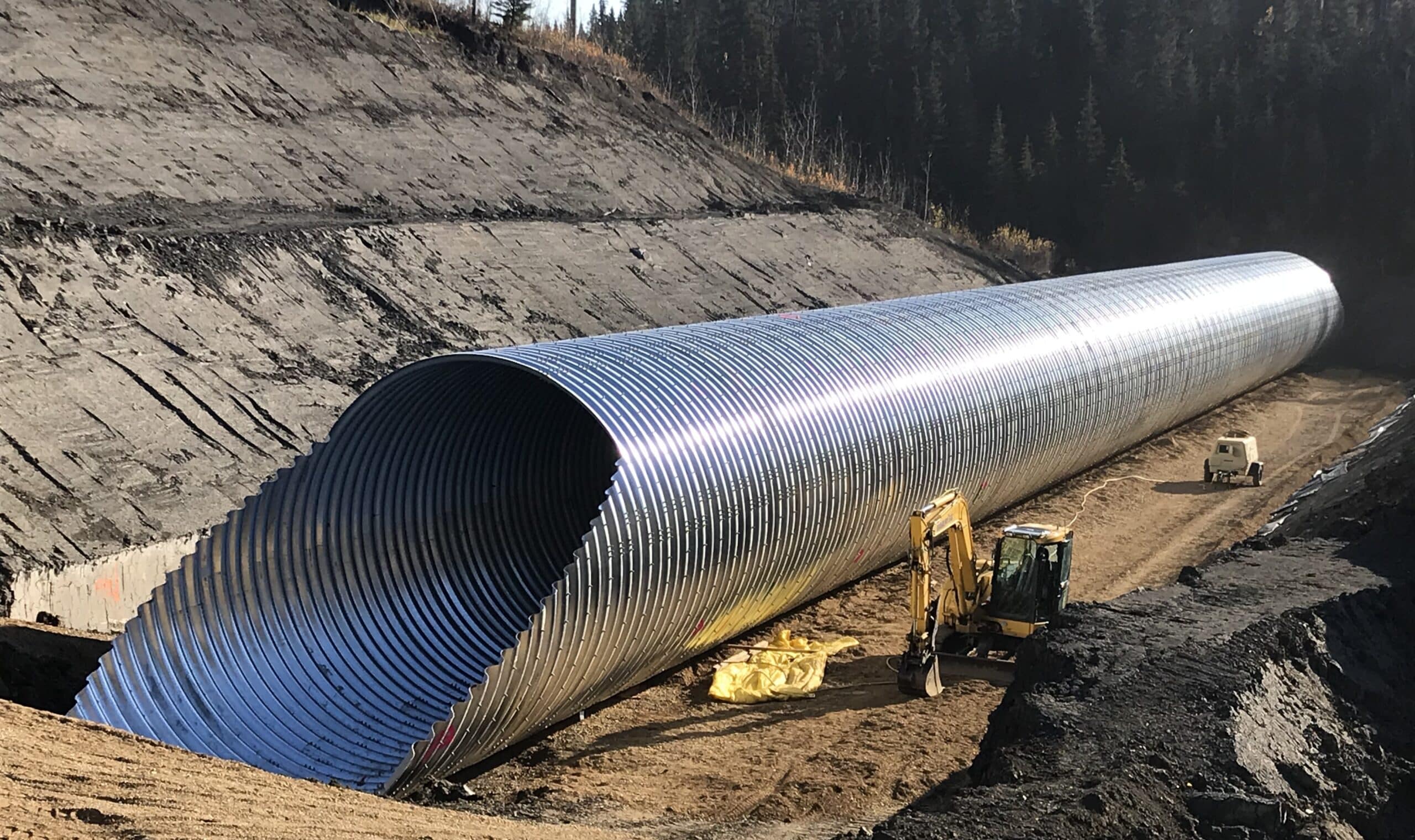 Angled view of deep-cover corrugated steel culvert