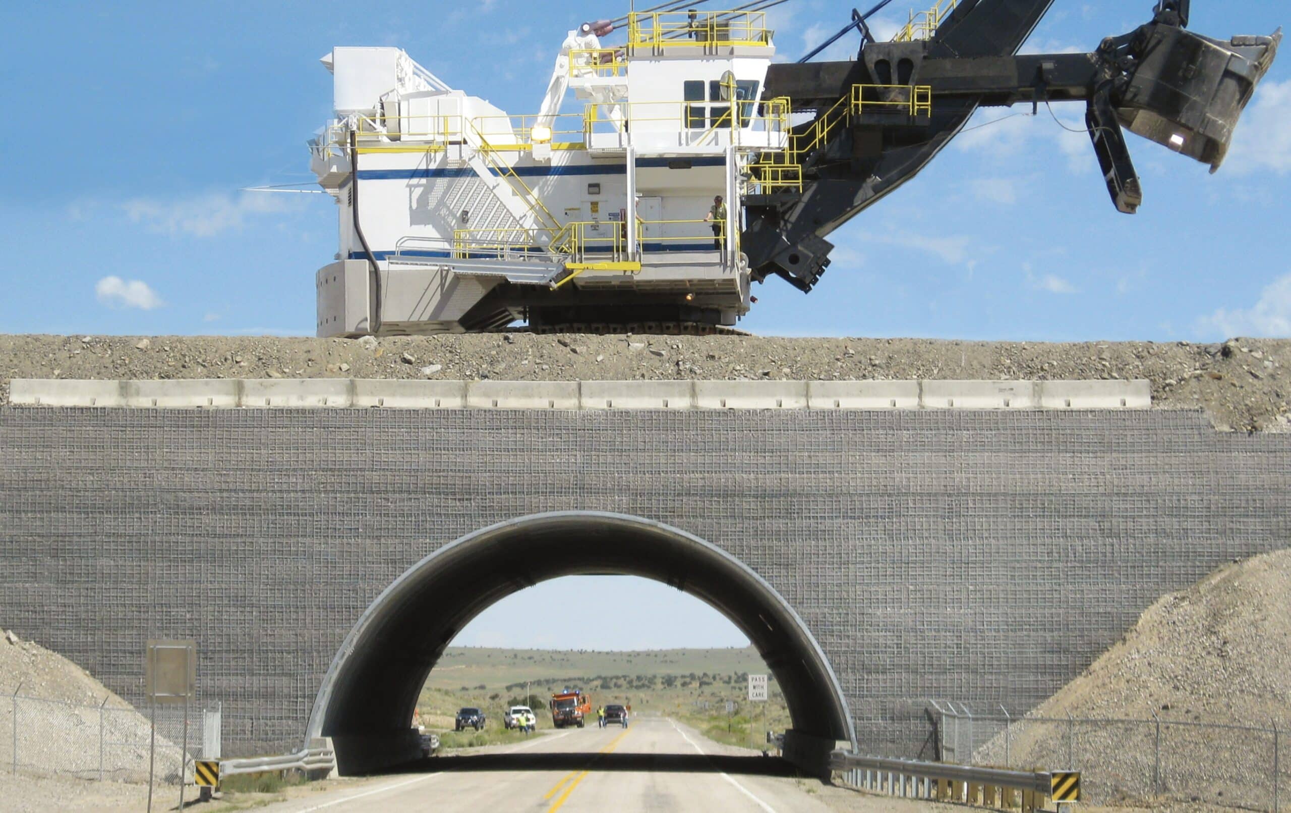 Through view of mine site heavy haul road conveyor crossing
